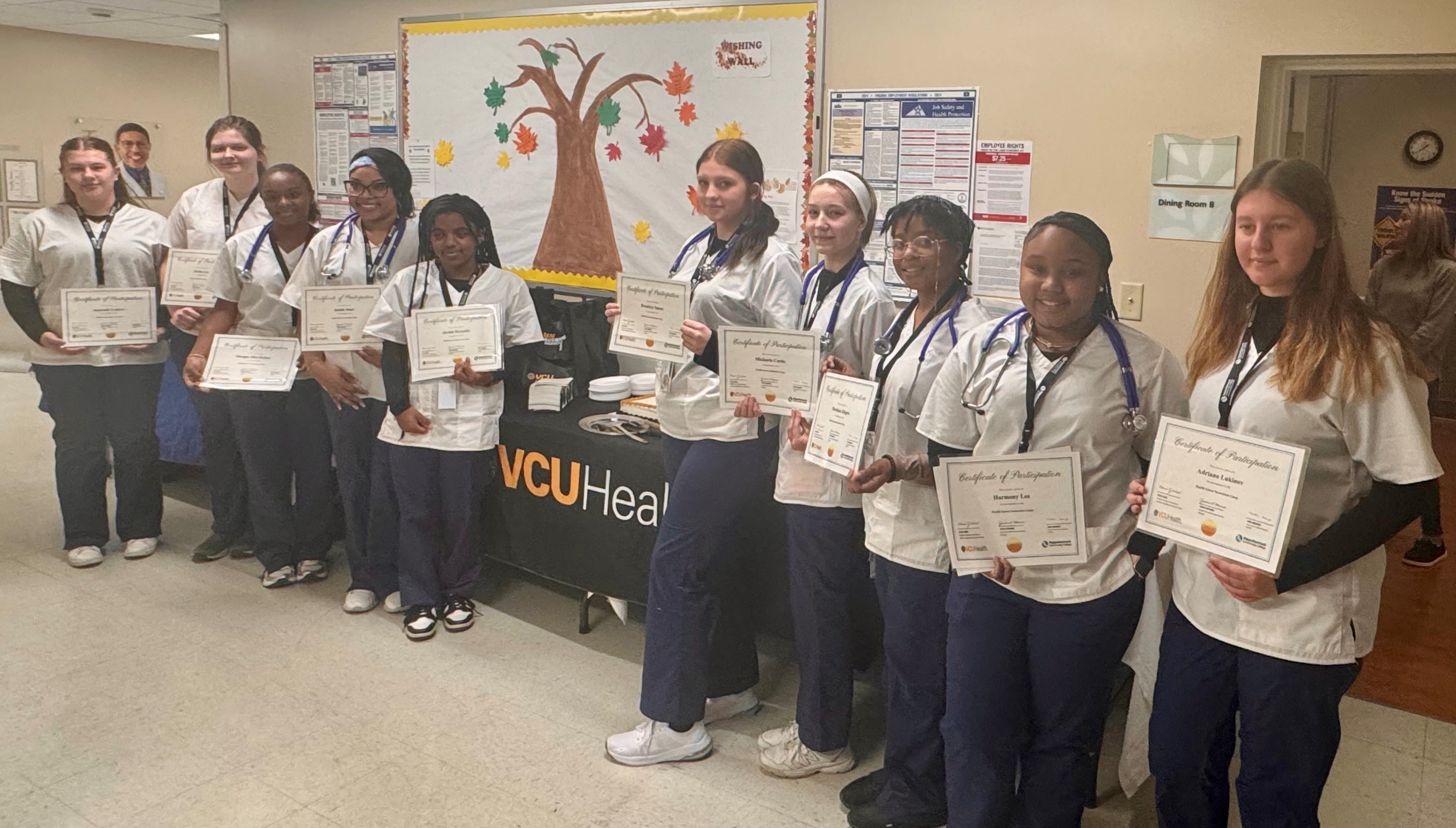 group of nursing students holding certificates