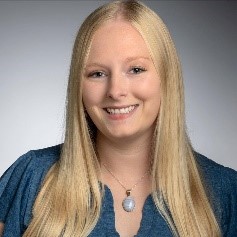 woman in teal blouse