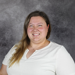 caucasian woman wearing a white blouse
